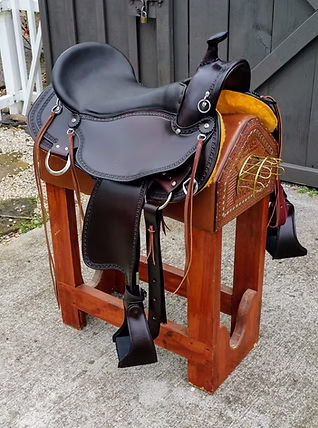 Tan Old Timer saddle with edge tooling and E-Z ride stirrups