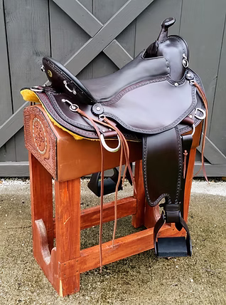 Tan Old Timer saddle with edge tooling and E-Z ride stirrups